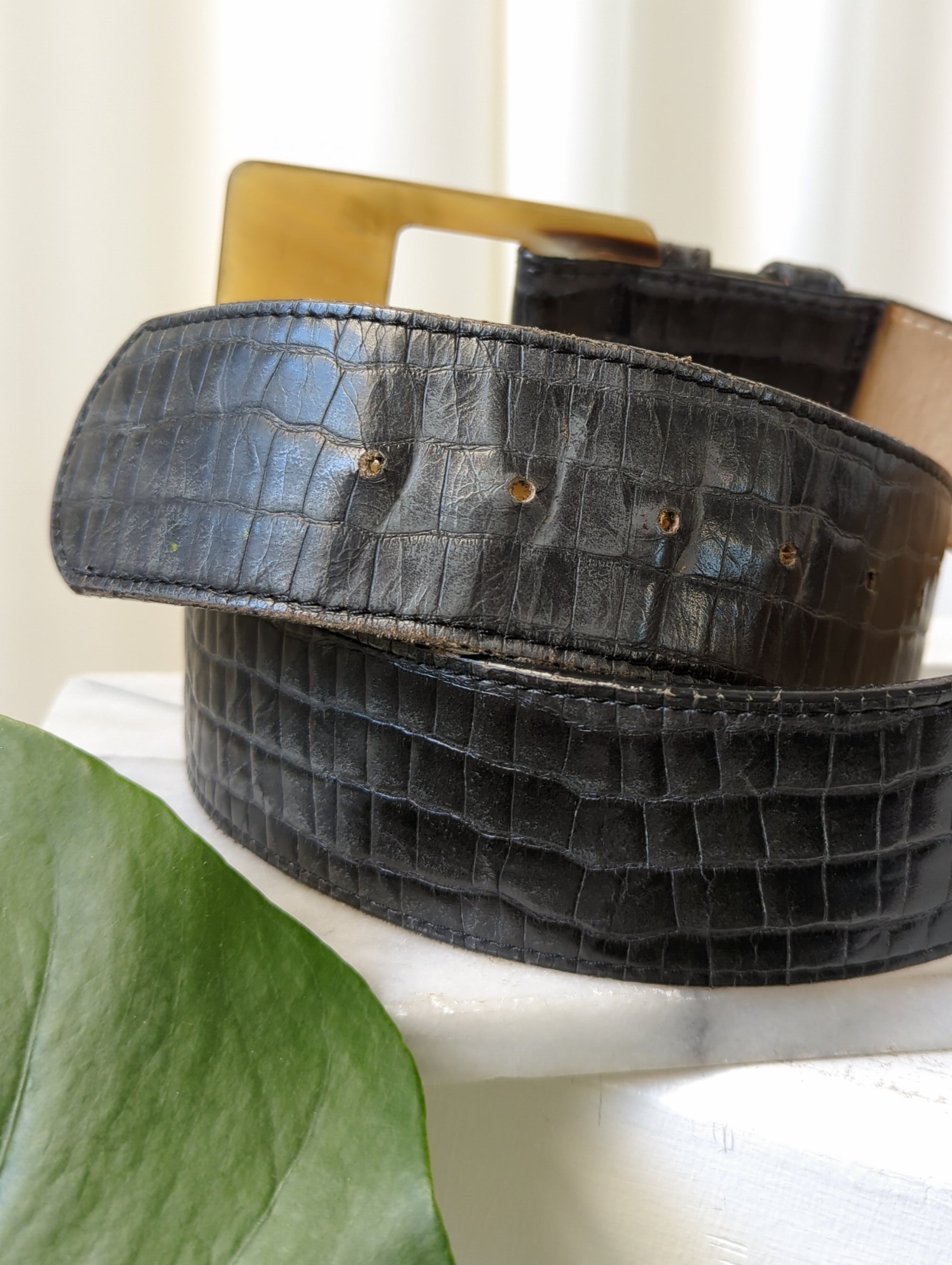 female buckle belt in crocodile-embossed leather