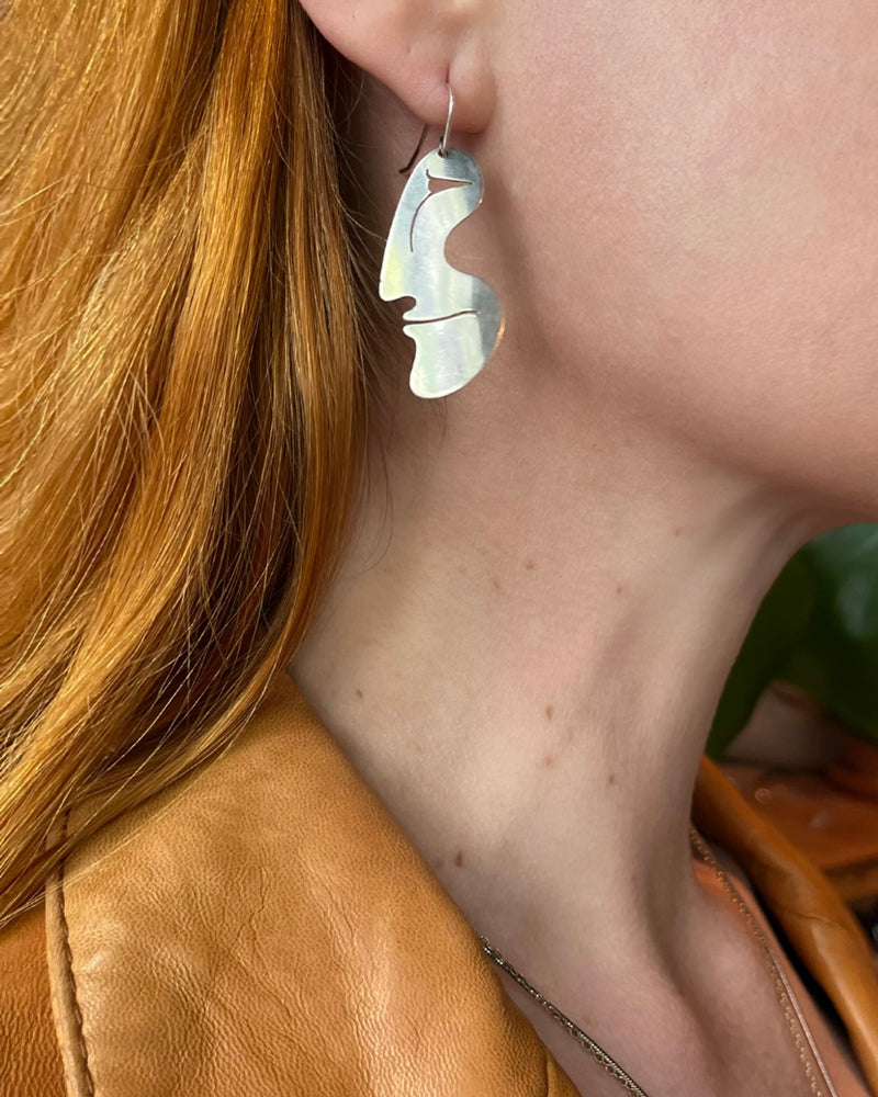 https://luckyvintageseattle.com/cdn/shop/products/lucky-vintage-seattle-sterling-silver-modernist-faces-earrings_1_800x.jpg?v=1653587706